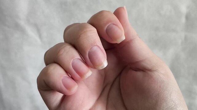 Healthy beautiful long fingernails woman close-up.