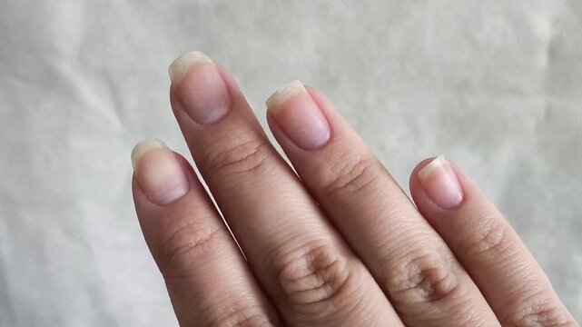 Healthy beautiful long fingernails woman close-up.