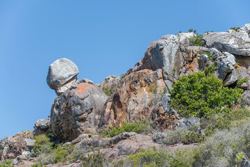 rock formations on green slope,  Robberg peninsula,  Plettenberg, South Africa