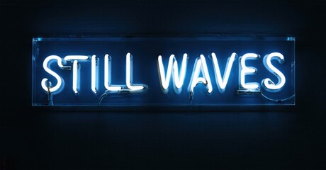 Obraz premium Bright neon sign displays text STILL WAVES. Dark background emphasizes glowing blue illumination. Minimalist aesthetic, modern art piece.