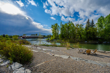 Peace Bridge over the Bow River with riverside seating area