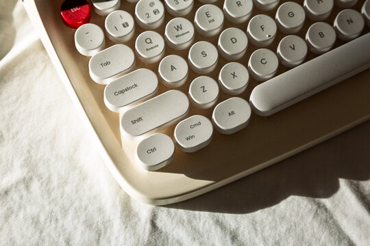 Close-up of a retro typewriter with round keys