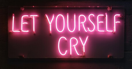 Bright pink neon sign displays text. Dark background emphasizes glowing message, creating dramatic visual impact. Simple, direct wording.