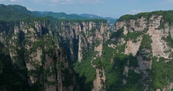 Establishing drone shot of a towering mountain landscape n Huangshi, Zhangjiajie