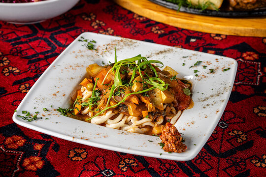 Traditional laghman noodles with rich meat sauce