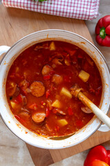 Sauerkraut Soup with sausage fresh and homemade cooked in a pot