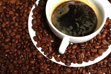 black coffee aroma coffee beans with black hot coffee in cup no people on a white background stock photo stock image