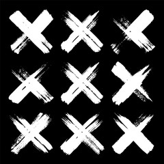 Obraz premium Grunge crosses, brush strokes, x mark, lines, ink smudges, hand-drawn scribble shapes. Handmade sketchy marks, acrylic stains, charcoal streaks. Paint textures, dry brush effect. Vector illustration