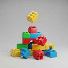 Obraz premium Stacked, colorful building blocks, some airborne, against a soft gray backdrop