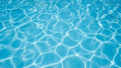 Obraz premium Clear blue swimming pool water surface with bright sun reflections and ripple patterns