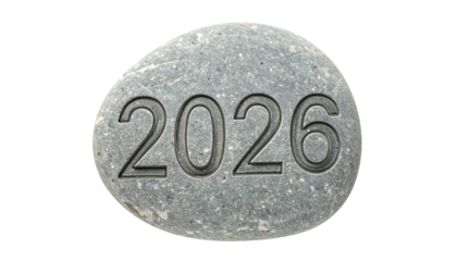 Year 2026 etched on a smooth, grey stone against a dark background