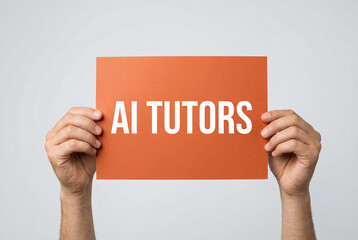 Hands holding orange sign with AI Tutors text for education technology.