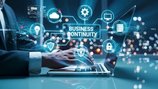 Business professional typing on laptop as glowing business continuity hologram interface floats above keyboard in night office scene