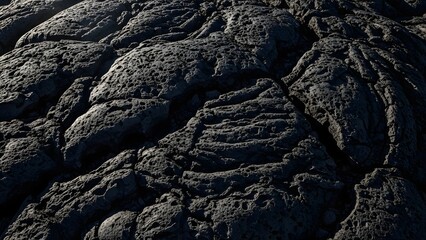 Close-up view of dark, rough, and textured solidified lava flow.