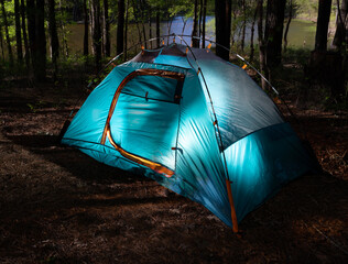 Backpacking tent pitched and lighted