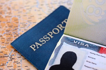 USA visa background. US visa in passport on United States geographical map close up. Immigration...