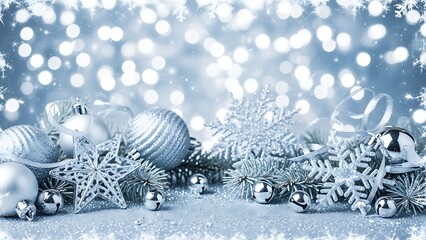 Silver Christmas baubles on snow for a happy winter holiday celebration card