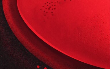 Abstract art features red shapes contrasted against grainy black background