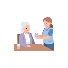 Fototapeta premium Nurse giving medication to elderly woman.