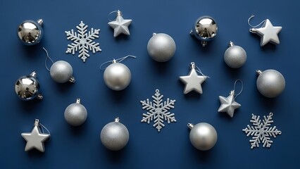 Golden Christmas balls decoration with silver ribbon on a blue background for holiday season celebration