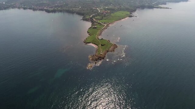 Aerial view of promontory on a thin peninsula along the Black Sea coastline in Ordu Turkey. Elevated perspective highlights Yason Burnu headland near Persembe Anatolia with dramatic cliffs.