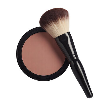 A professional cosmetic makeup brush with soft bristles gently rests beside a round compact case of face powder, isolated on transparent background