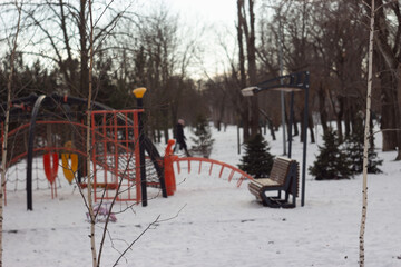 Children Playground Covered with Snow in Winter Park