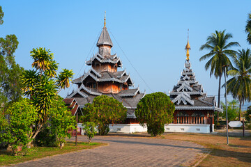 Naklejka premium The intricate Shan-style teak architecture of Wat Hua Wiang in Mae Hong Son, Northern Thailand