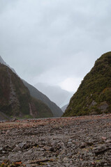 Mountain Valley Opening Between Two Slopes at Fox Glacier, New Zealand