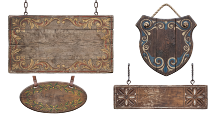 Collection of four antique weathered wooden signs or plaques, rustic medieval style shields and boards with ornate painted decoration, set of empty wooden banners ready for text or advertisement