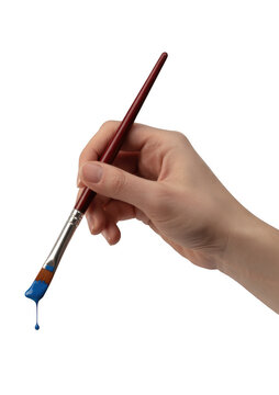 Hand holding paintbrush with blue paint dripping isolated on a transparent background
