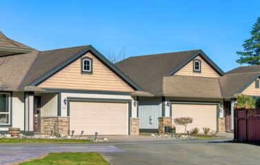 Row of nice residential houses on bright winter day in British Columbia, Canada
