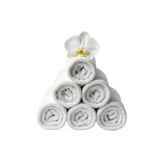Pile of towels with white orchid on top