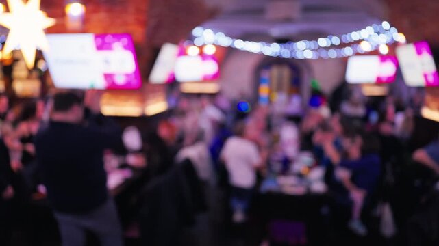 Busy pub with vibrant illumination, Individuals socialize energetically within lively city bar scene