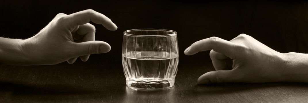 An optimist and a pessimist's opinion about a glass of water