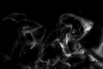 White steam smoke on solid black background with abstract blur motion wave swirl use as an overlay effect for vapor cigarette dry ice hot water and food soup