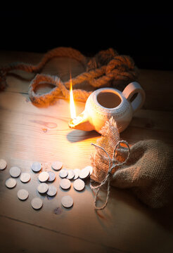 An oil lamp and silver coins