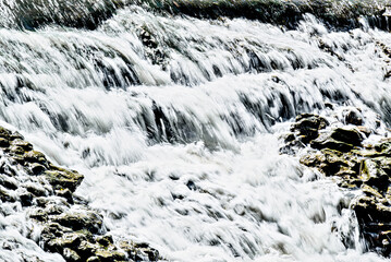 Water cascading over the rocks with a silky effect