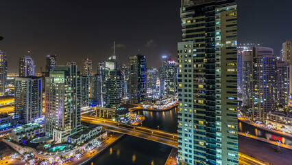 Naklejka premium Aerial top view at night timelapse of Dubai Marina in Dubai, UAE