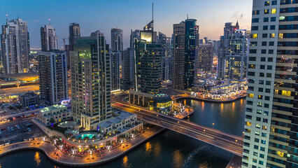 Aerial top view day to night timelapse of Dubai Marina in Dubai, UAE
