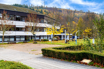 Bad Laasphe, Siegen-Wittgenstein, town hall in autumn grounds before wooded hill