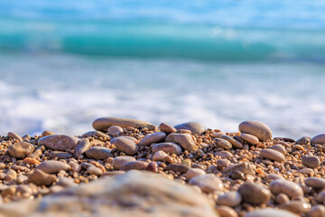 Serene pebble beach with blue waves in a tranquil coastal scene