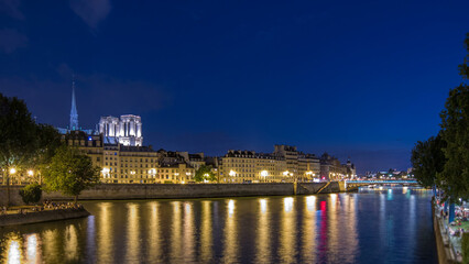 Le Pont D'Arcole bridge after sunset with people and boats day to night timelapse, Paris, France, Europe
