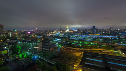 Fototapeta premium Evening top view of three railway stations day to night timelapse at the Komsomolskaya square in Moscow, Russia