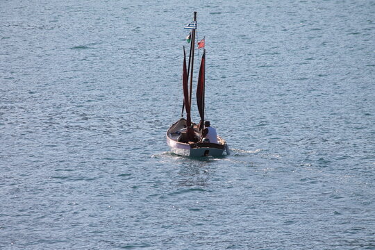 Traditional wooden sailing boat on the calm sea in Nidri lefkada.