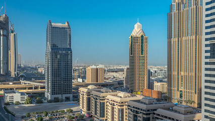 Fototapeta premium Dubai downtown skyline night to day timelapse and Sheikh Zayed road traffic, UAE