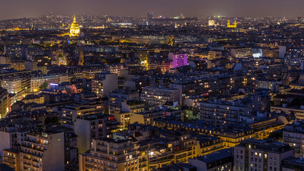 Fototapeta premium Aerial panorama above houses rooftops in a Paris day to night timelapse