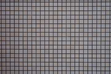グレーの格子状タイル模様