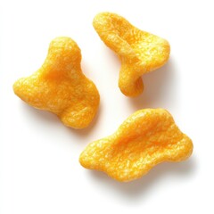 A photograph of three puffed corn snacks, isolated on a white background as an advertising product shot with soft studio lighting.
