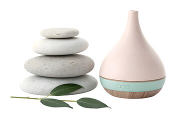Pink and mint green essential oil diffuser next to stacked zen stones and a green leaf isolated on transparent background